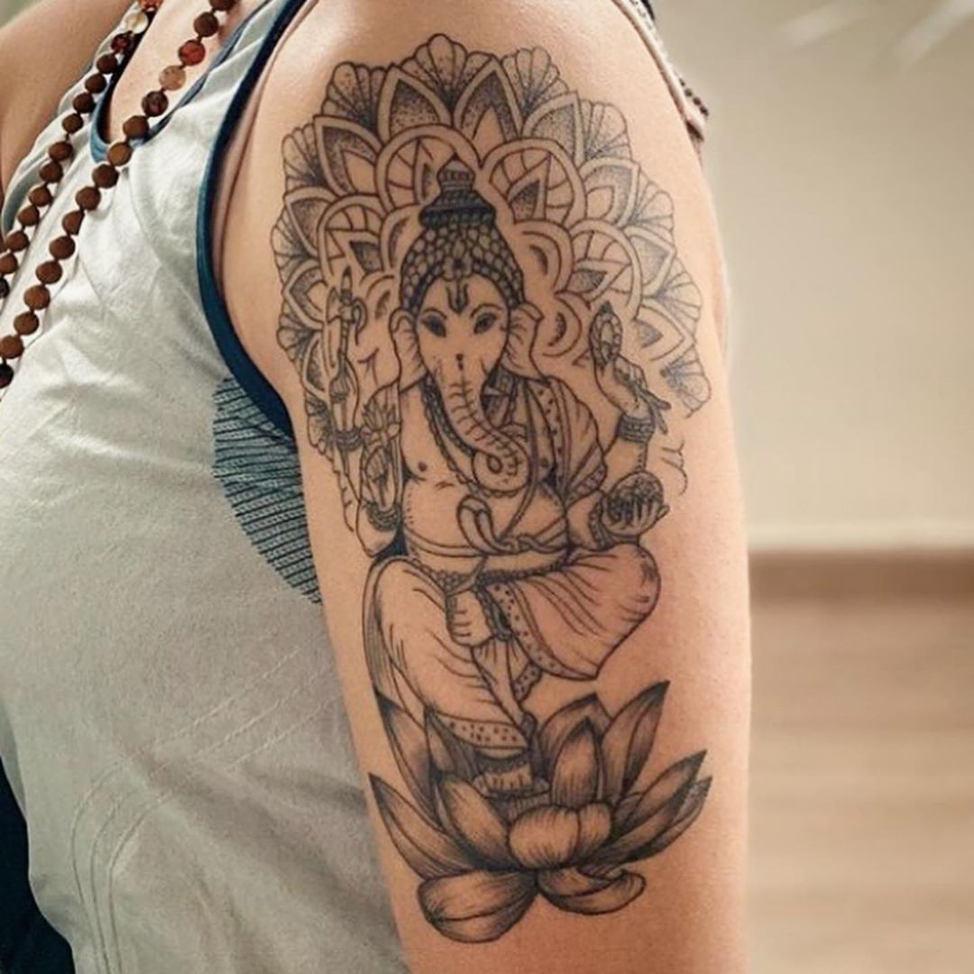 ganesh tattoo forearm