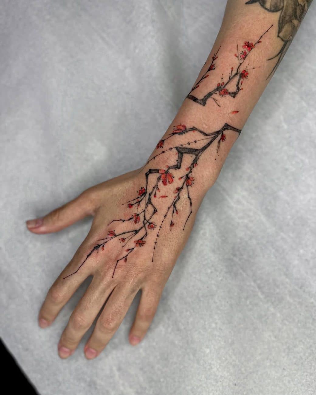 cherry-blossom-wrist-tattoo-leticia-toledo-brazil