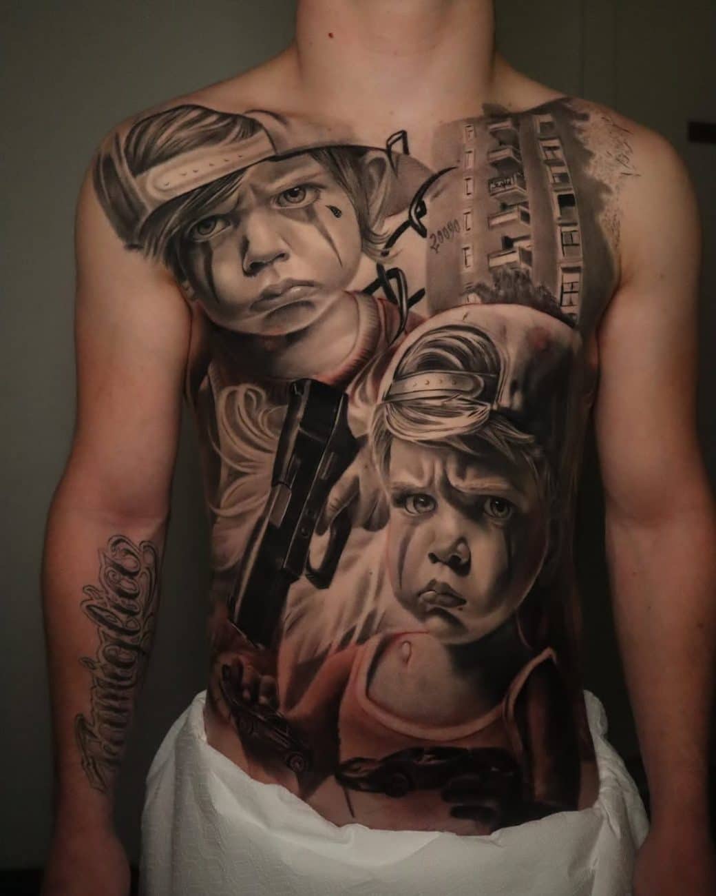 chicano tattoo two kids jaw tattoo