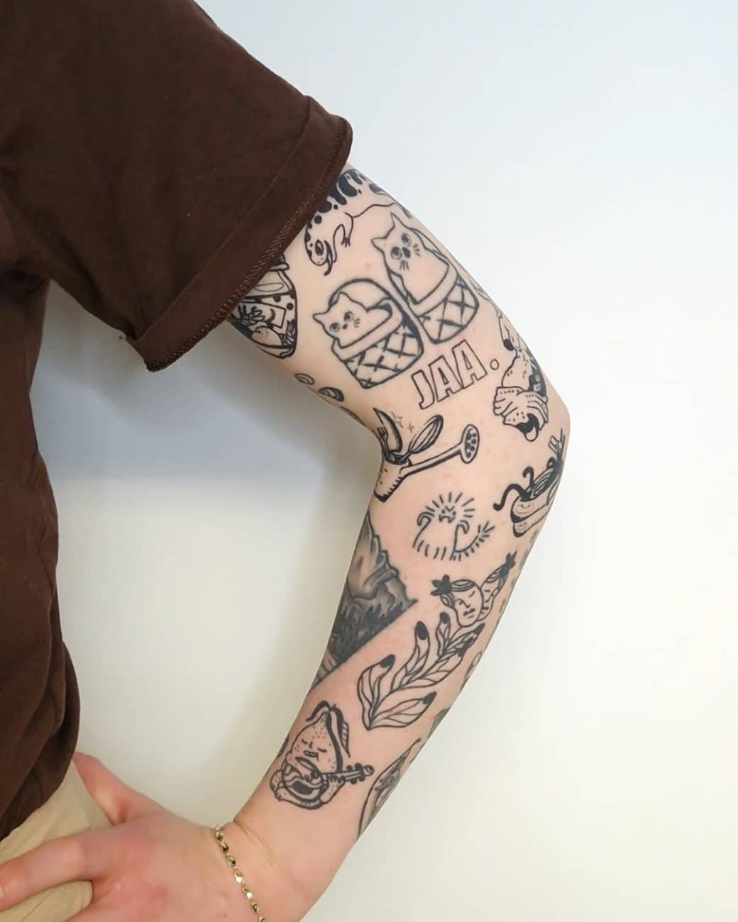 patchwork arm tattoo lenni
