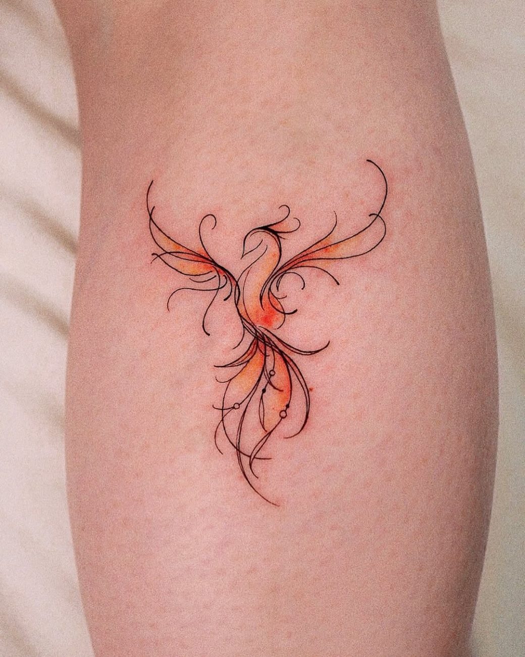 phoenix bird tattoo abstract style yeowool tattooer