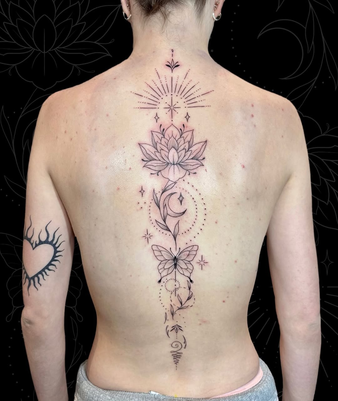 spine-women-tattoo-geometry-moon-butterfly-grizzly-ayre